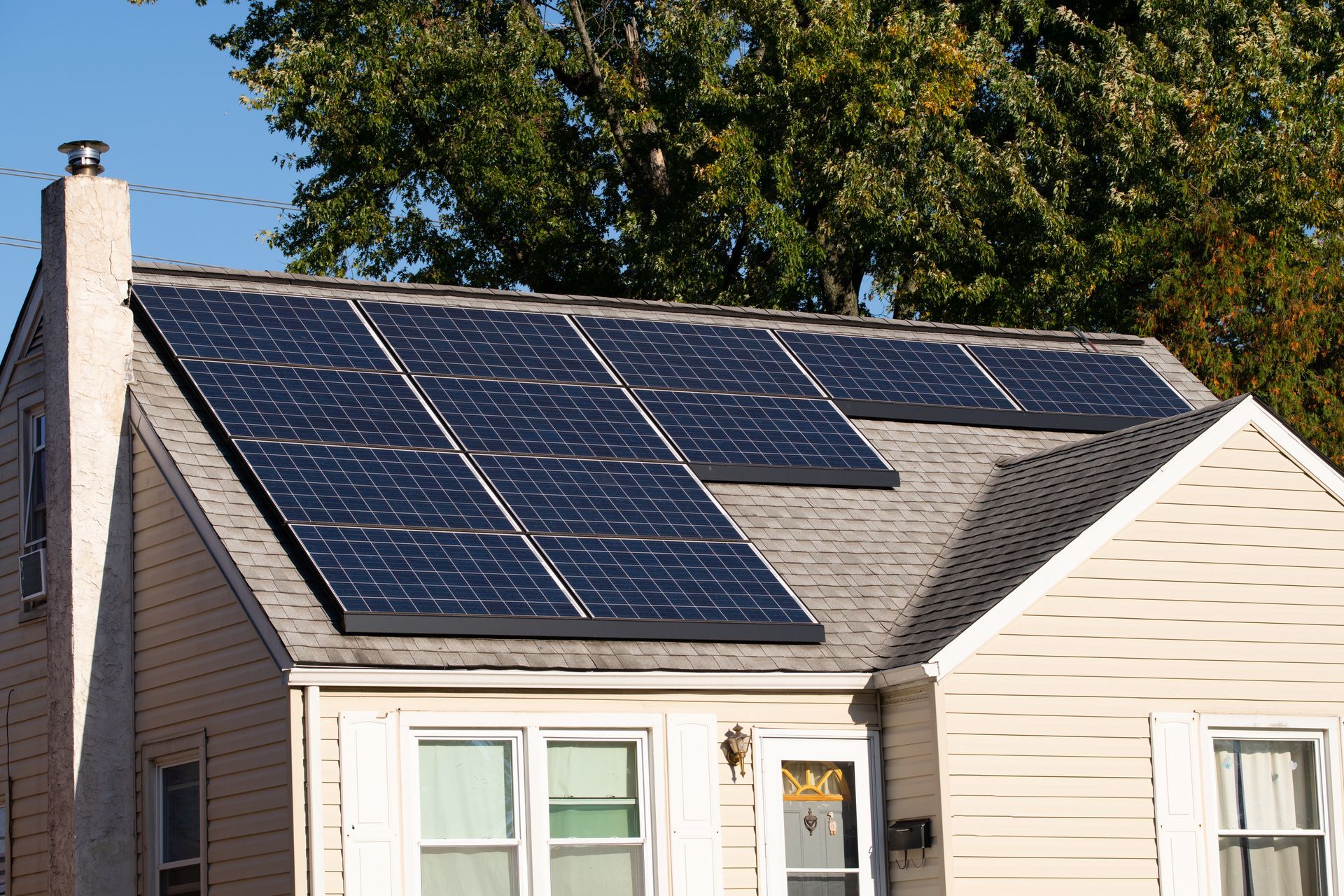 House roof with solar panels on a sunny day
