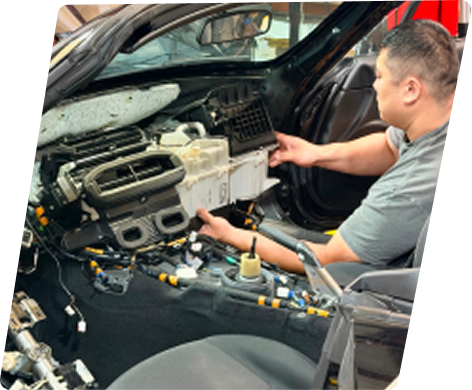 Expert Technician at work on vehicle | TLS Motorworks