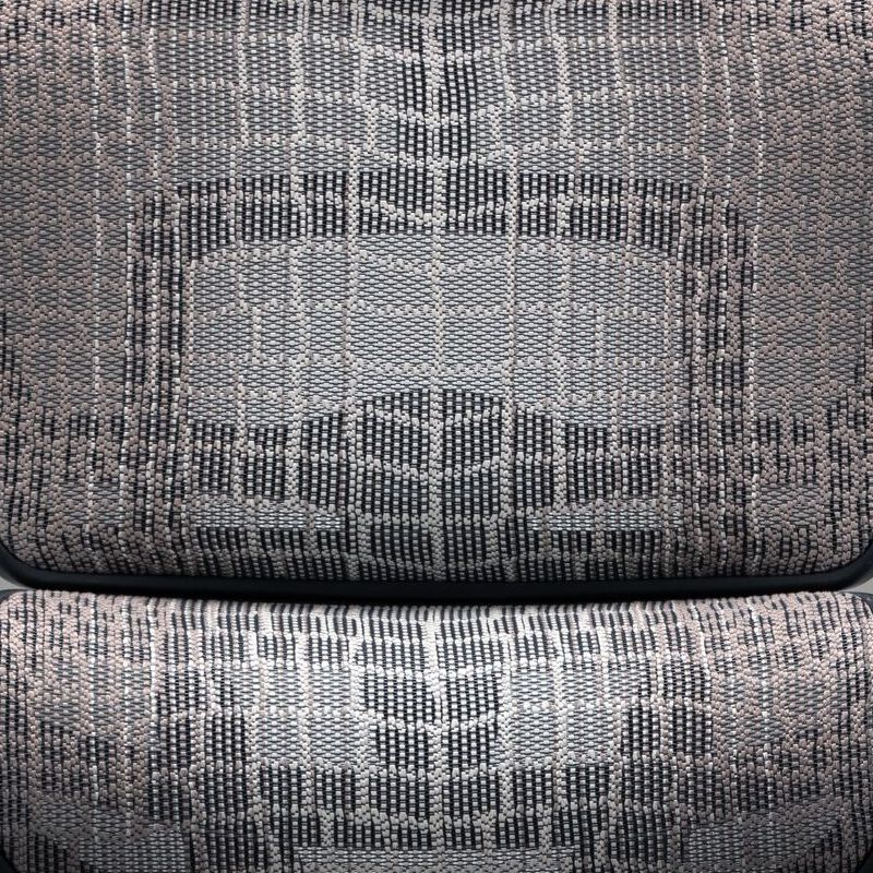 Close up of the texture of the Ergohuman gaming chair mesh. It has a snake-like pattern in shades of grey. 