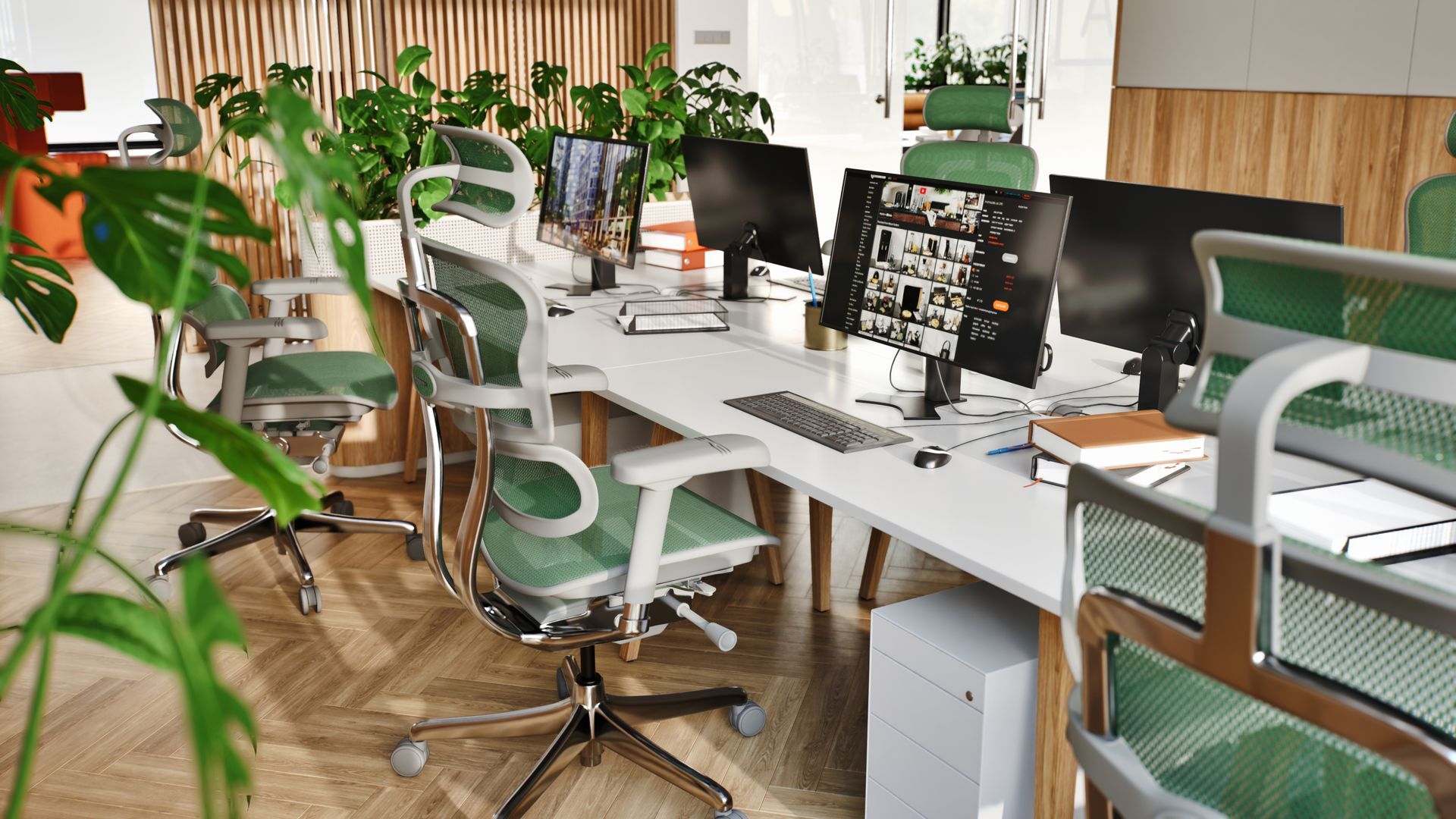 An office space with exposed brick wall and concrete floors. There are a few tables & desks. At each desk are the Ergohuman Elite in black frame with black mesh.