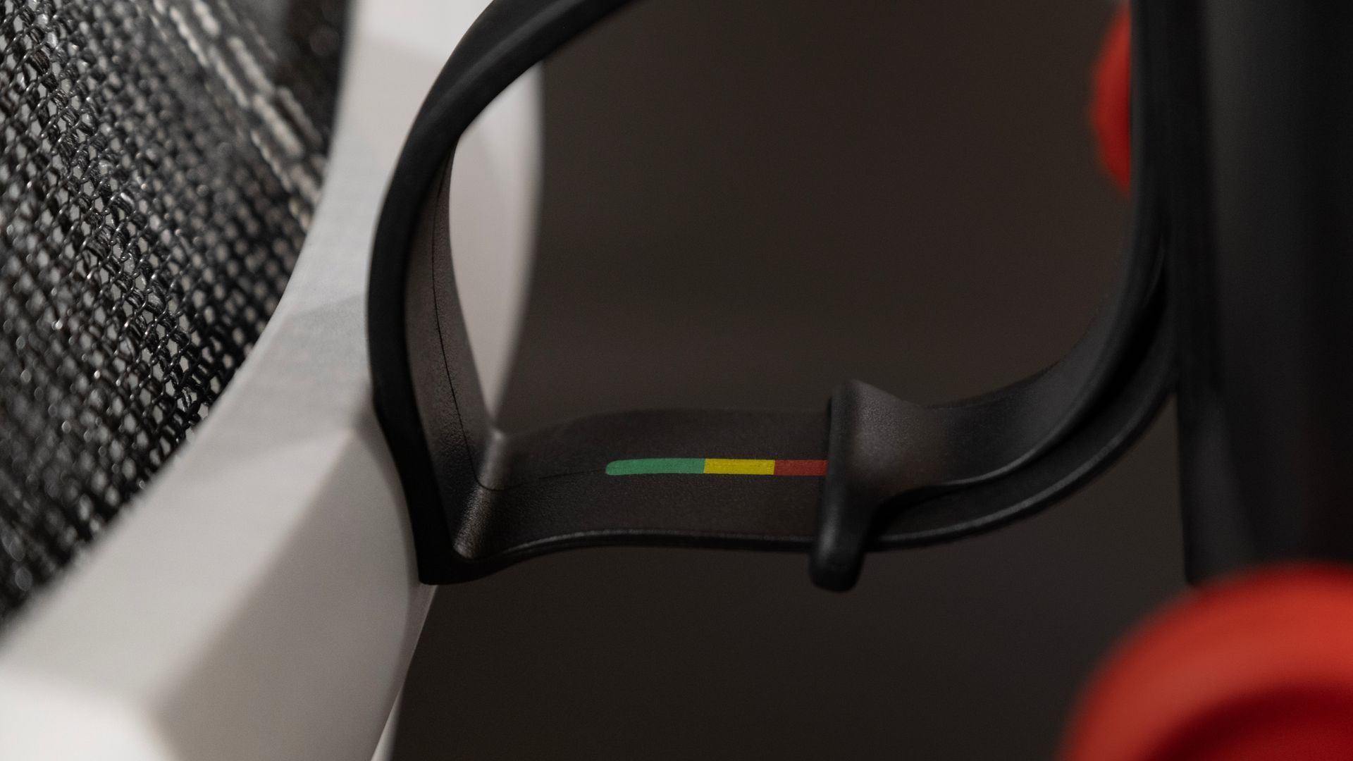 Close up of a mesh gaming chair's lumbar support flex panel.