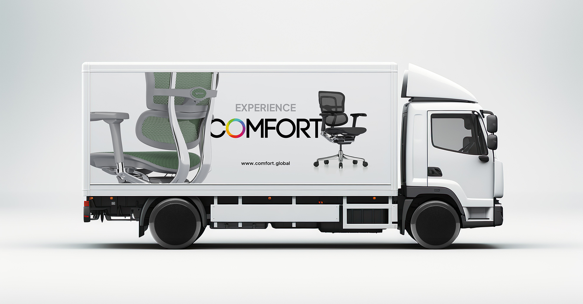 Rendered image of a white lorry, with the word 'experience comfort' on the side, featuring two Ergohuman chairs, one in green, and one black. The wheels of the lorry are chair castors to tie in the chair imagery. The chair is on a white background.