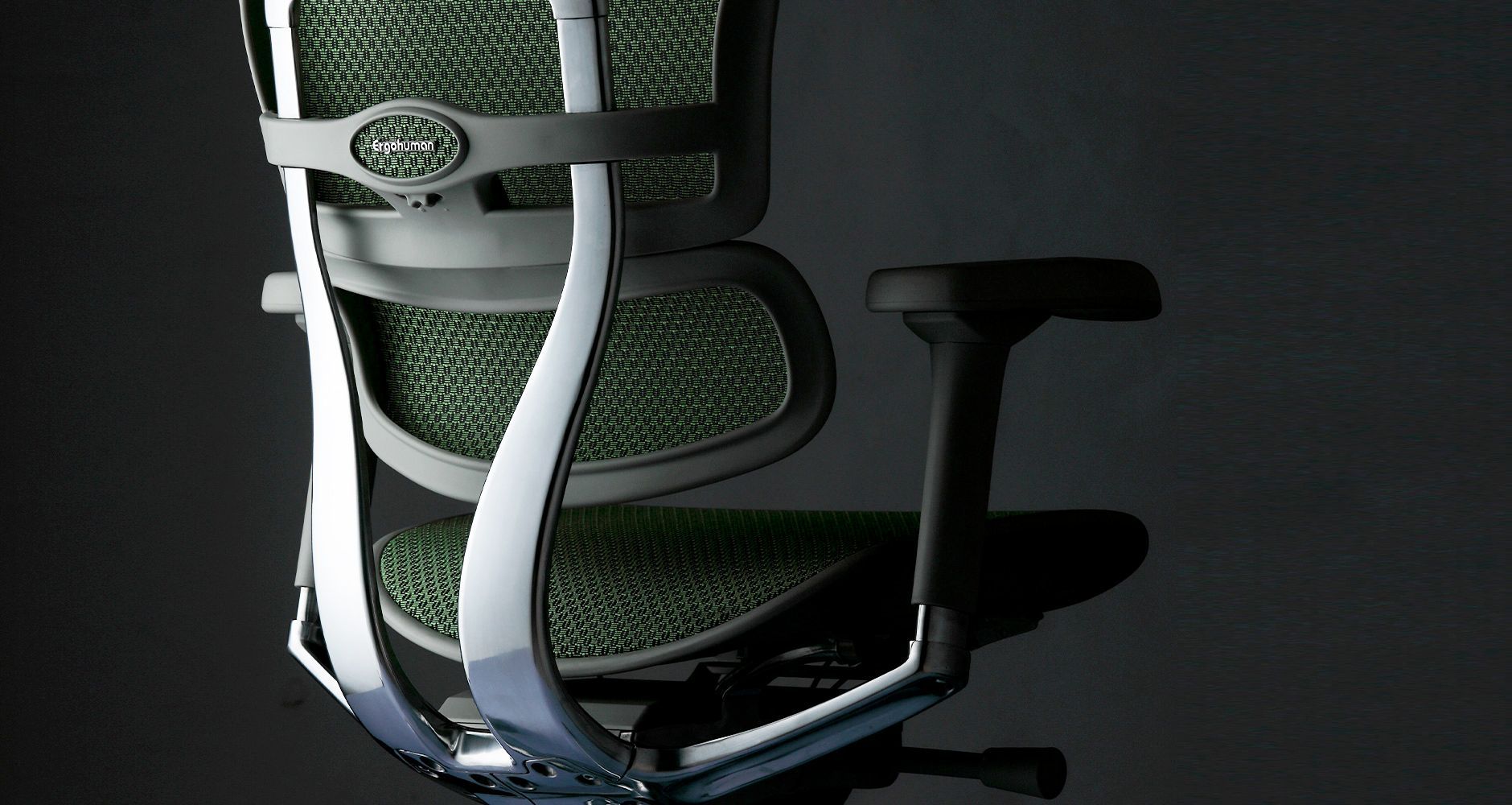 Ergohuman office chair back of chair, the colours are black on black, the background is black,