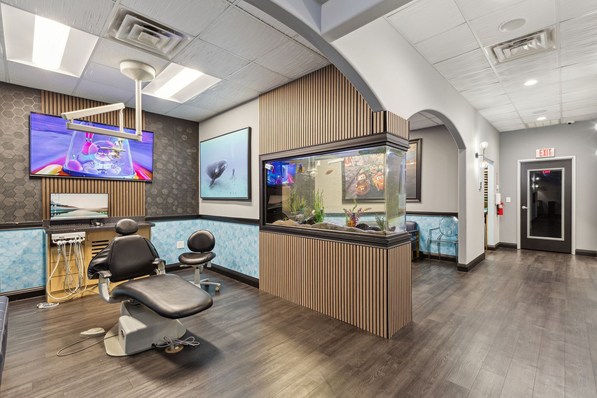Aqua Dental and Orthodontics in Duncanville, TX. A dental office with a dental chair and an aquarium.