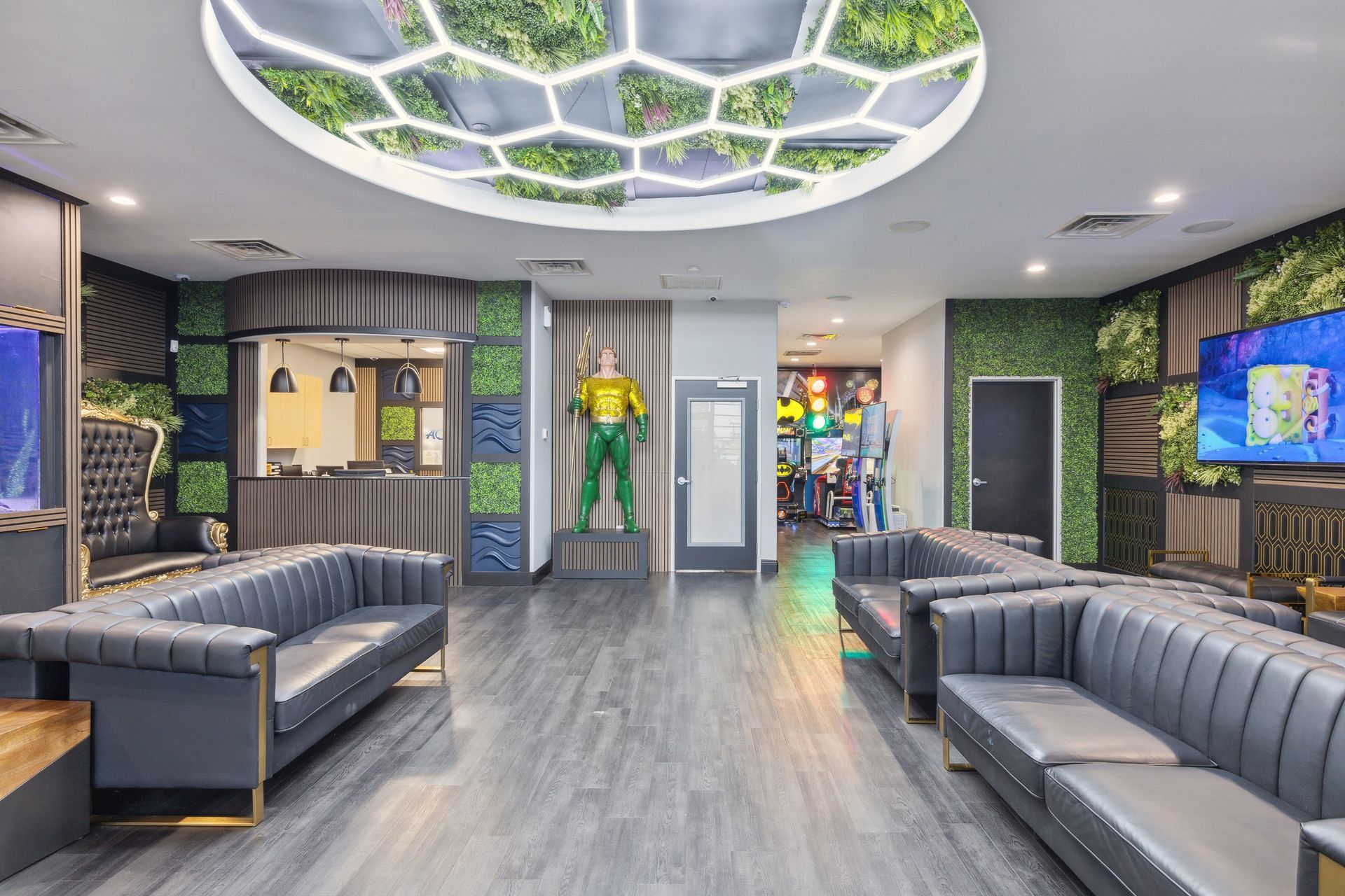 Aqua Dental and Orthodontics in Duncanville, TX. A waiting room with a superhero statue on the wall.