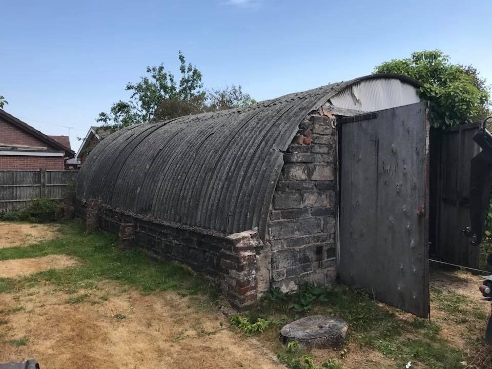 Front view of a wooden flat-roofed garage