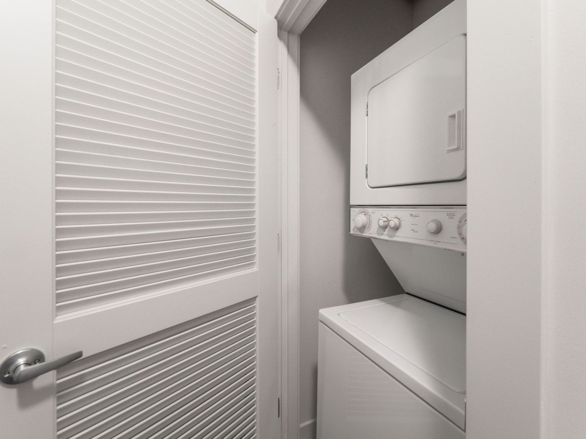 a small laundry room with a washer and dryer