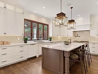 There is a large island in the middle of the kitchen.