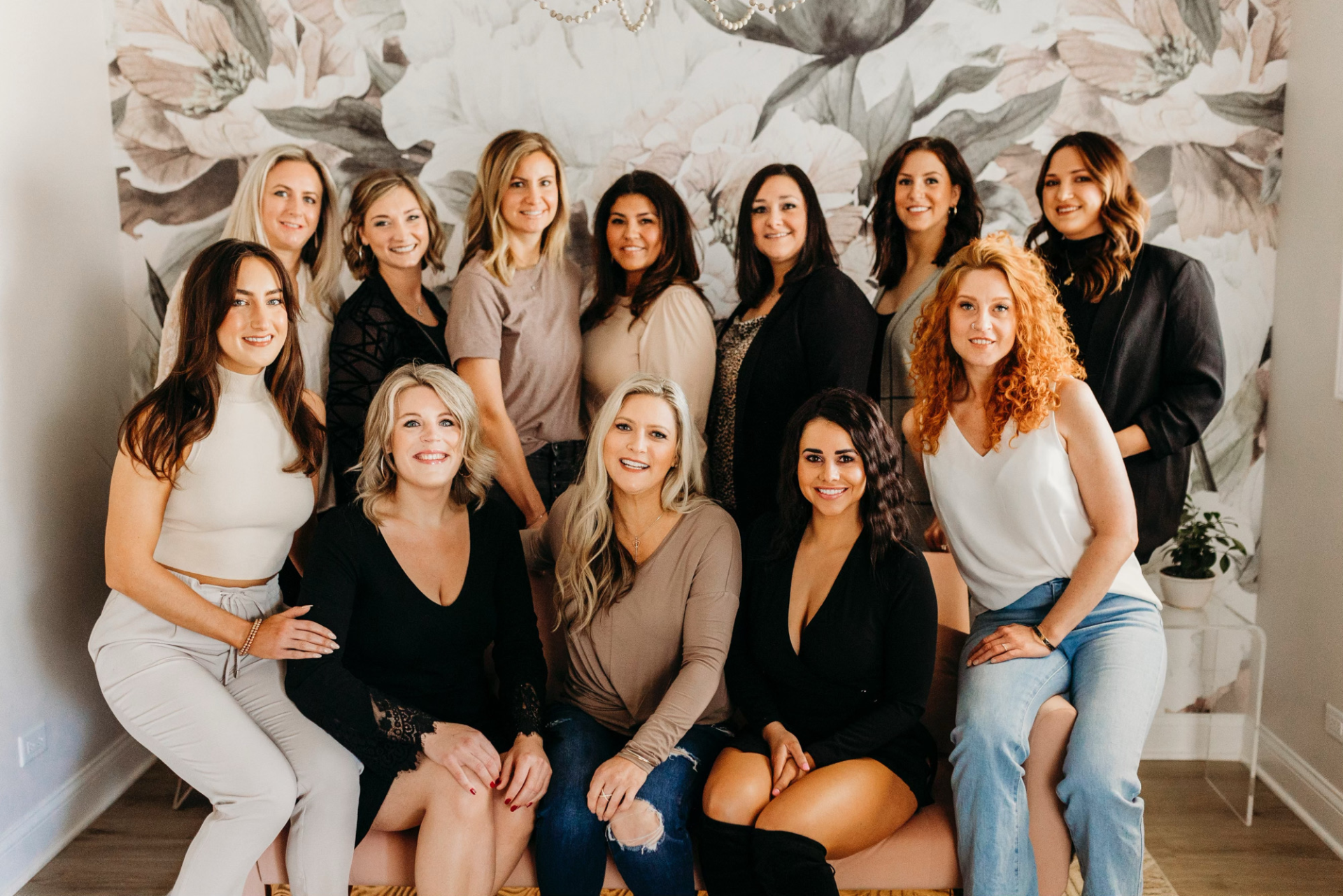 A group of women are posing for a picture together.