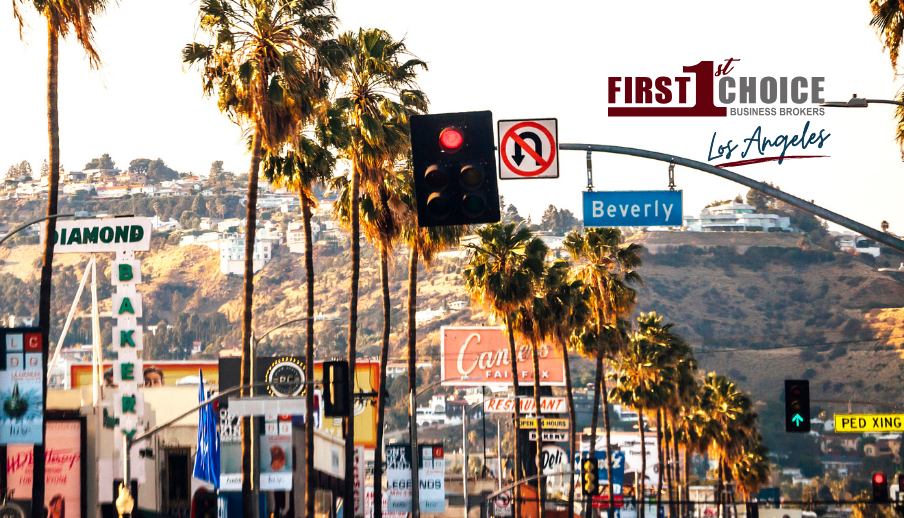 A picture of a city street with palm trees and a sign that says first choice