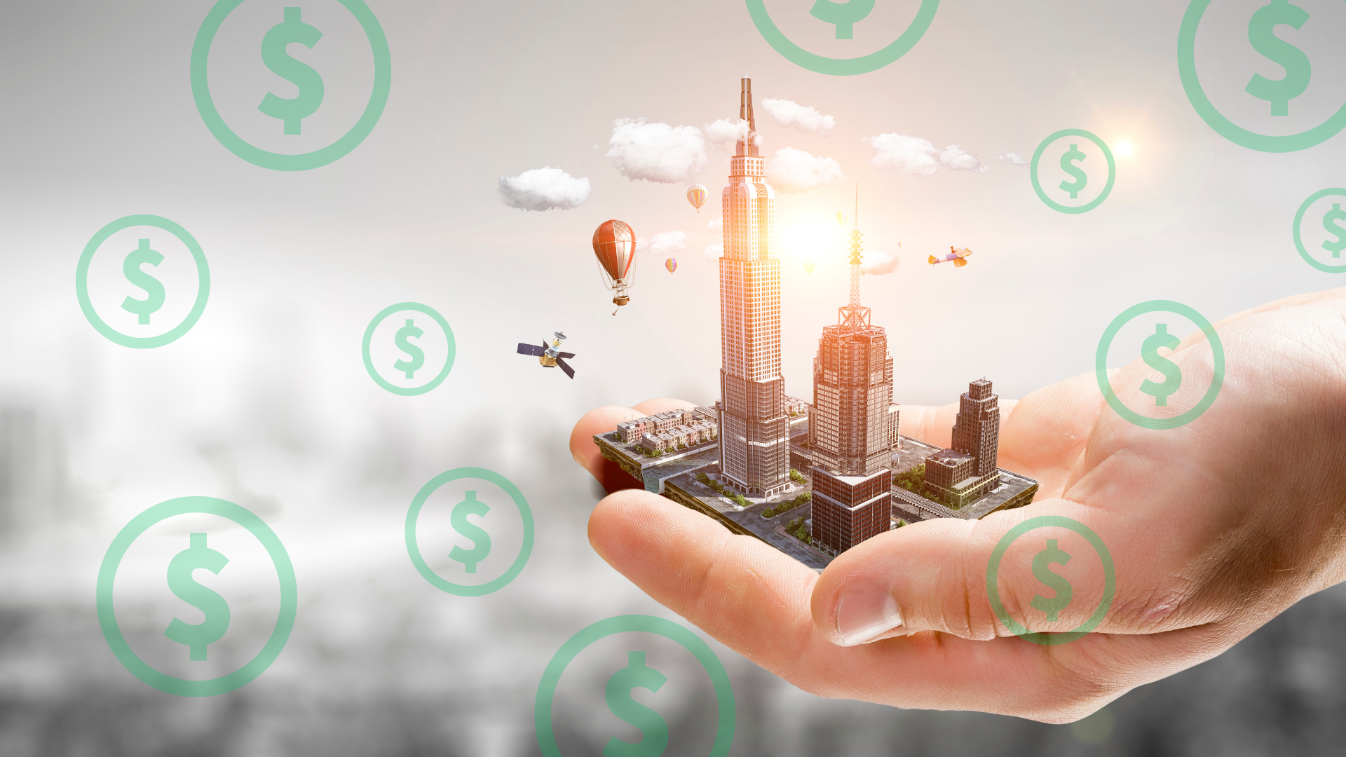 A person is holding a model of a city in their hand surrounded by dollar signs.