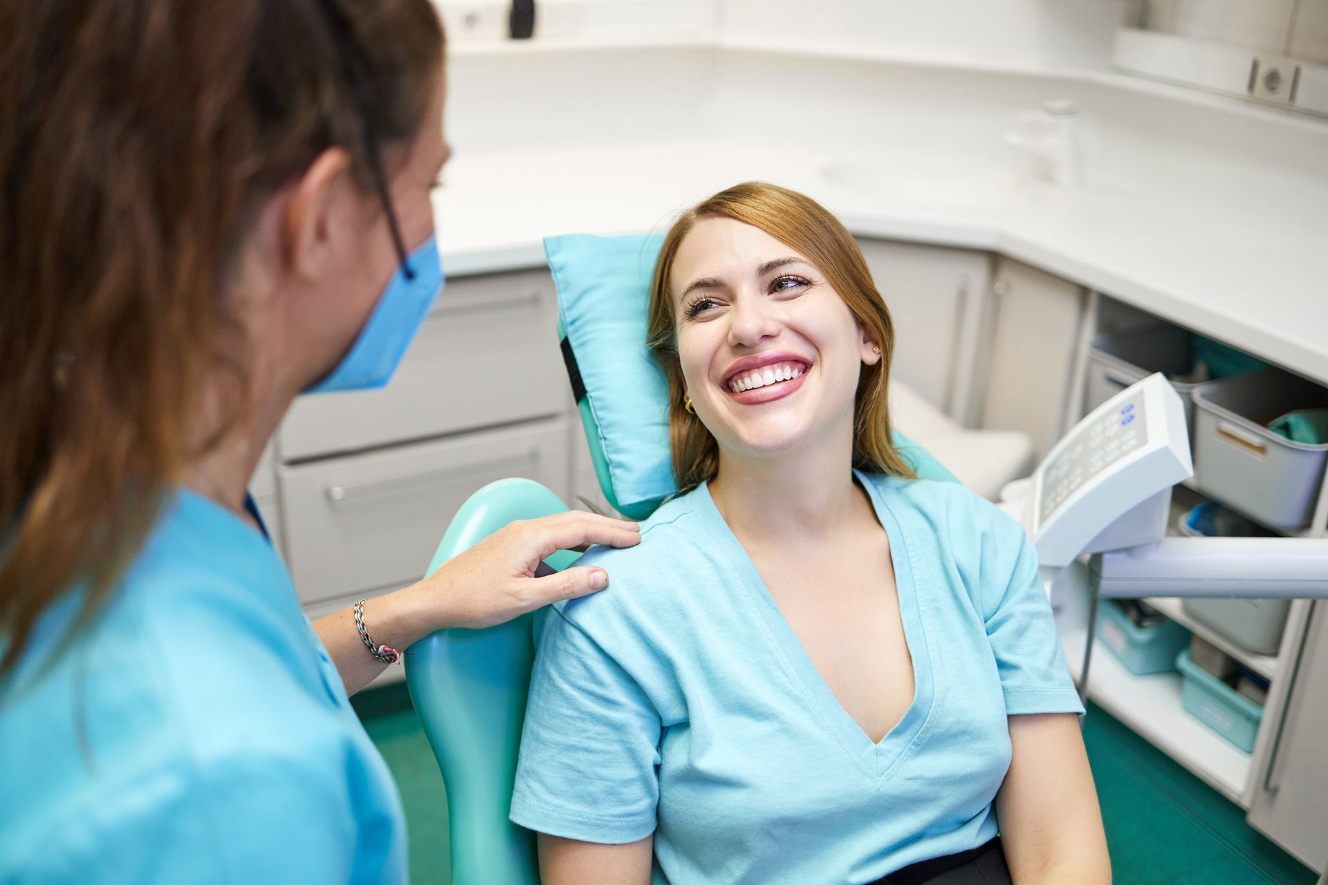 Dentists at Sumter Family Dental Center in Sumter, SC, speaking with a patient before a dental crown surgery Dentists at Sumter Family Dental Center in Sumter, SC, speaking with a patient before a dental crown surgery