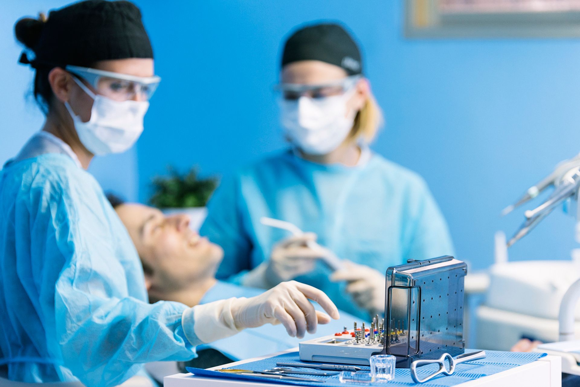 Dentists at Sumter Family Dental Center in Sumter, SC, with a patient during a dental crown surgery Dentists at Sumter Family Dental Center in Sumter, SC, with a patient during a dental crown surgery