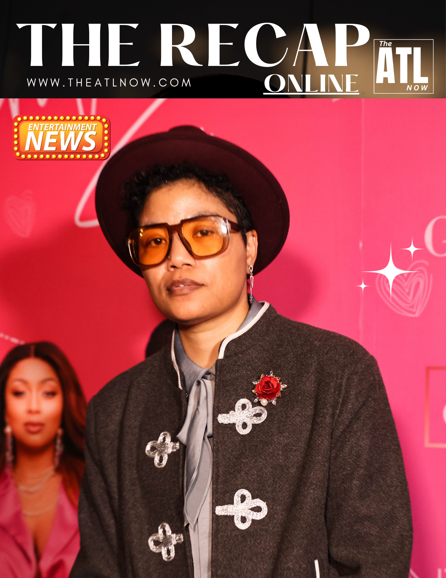 Person in hat and orange glasses standing against a pink event backdrop with The Recap and ATL Online logos