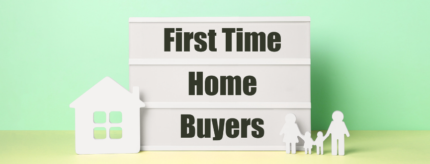 A sign that says `` first time home buyers '' next to a house and a family.