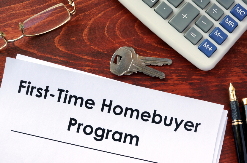 A first-time homebuyer program is written on a piece of paper