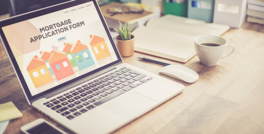 A laptop computer is open to a mortgage application form.