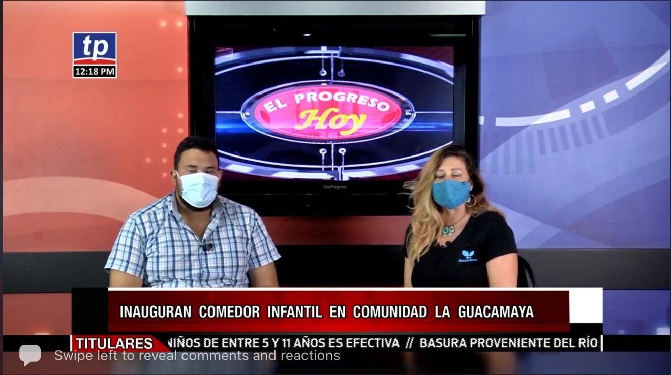 Two masked presenters at a news desk with a screen showing “El Proceso Hoy” behind them