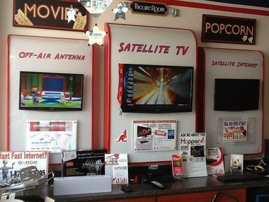 Electronics store display with TVs advertising off-air antenna, satellite TV, and satellite zones