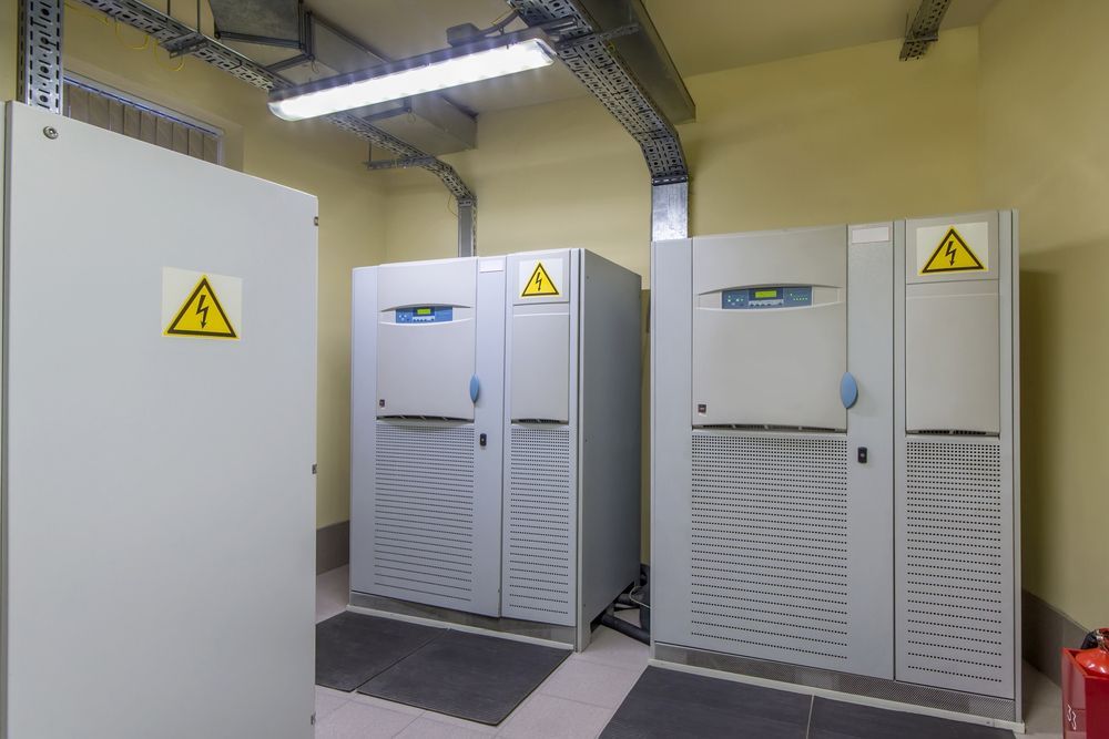 Electrical Room With Three Large Gray Cabinets — Cairns Electrical Rewinds & Repairs In Bungalow, QLD