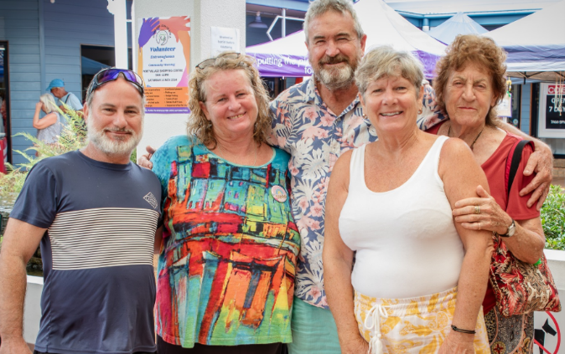 A group of people are posing for a picture together.