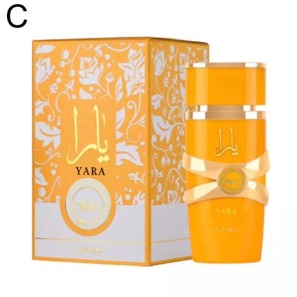 Flacone di profumo Orange Yara e scatola coordinata con decorazioni floreali bianche su sfondo bianco.