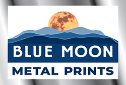 Blue Moon Metal Prints logo with moon and mountain graphic in blue and gold
