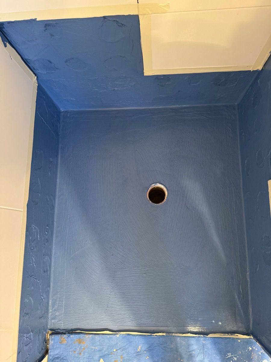 Blue painted box with a small circular hole in the center of the floor.