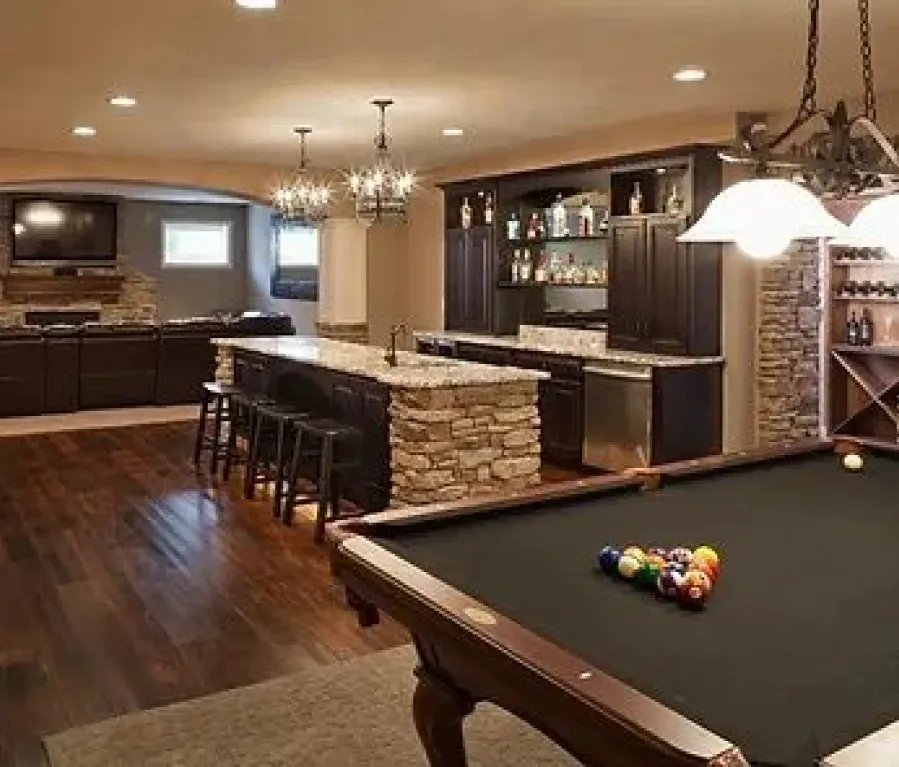 There is a pool table in the middle of the room.