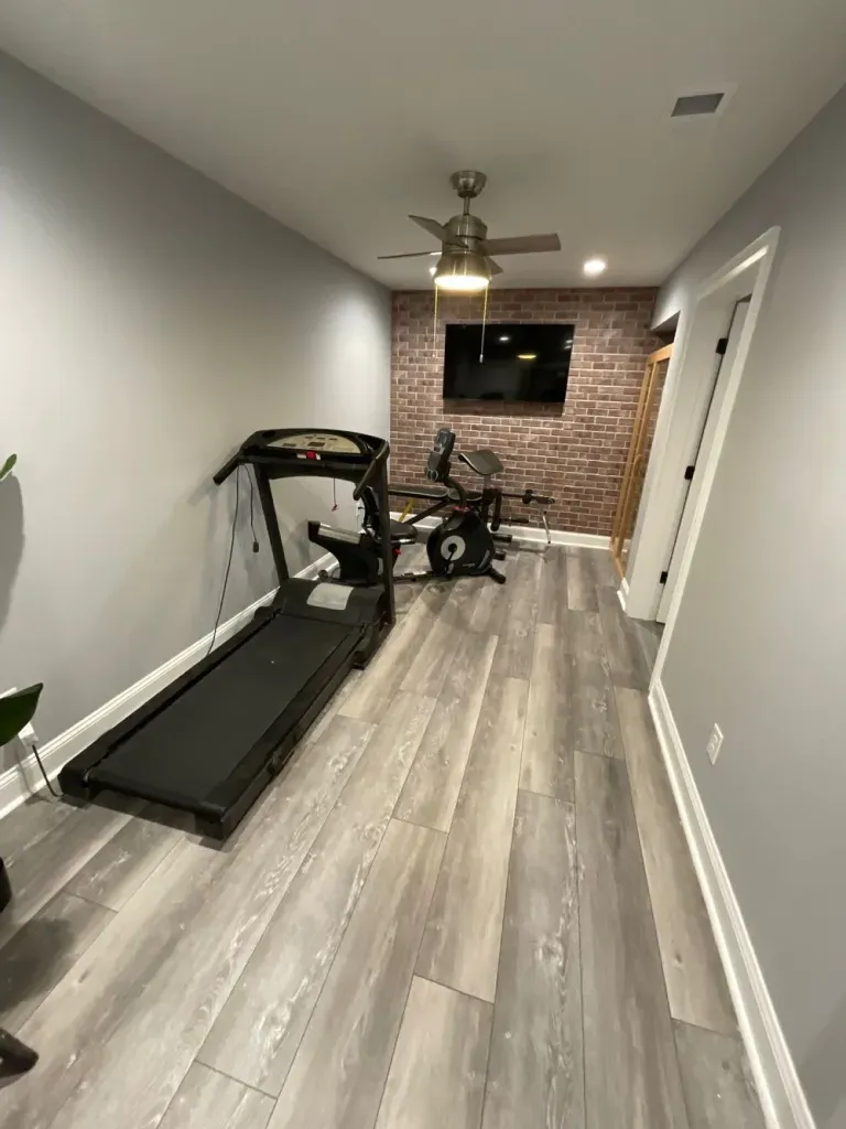 There is a treadmill in the middle of the room.