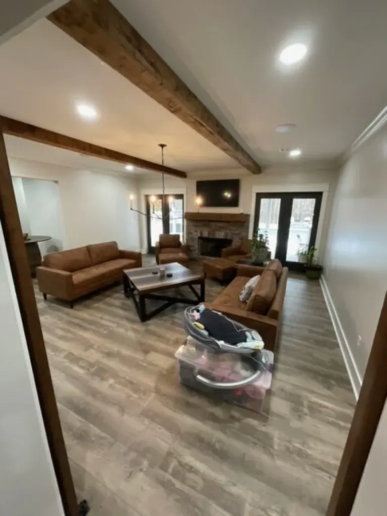 A living room filled with furniture and a fireplace.