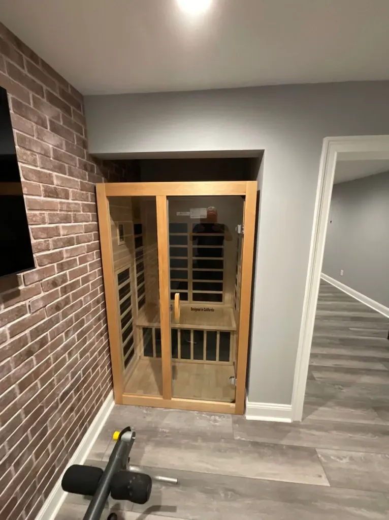 There is a sauna in the corner of the room.