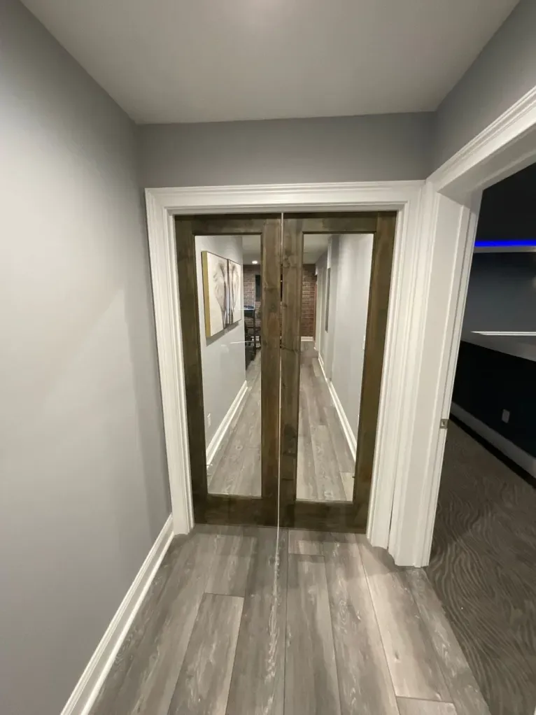 A hallway with sliding glass doors in a house.