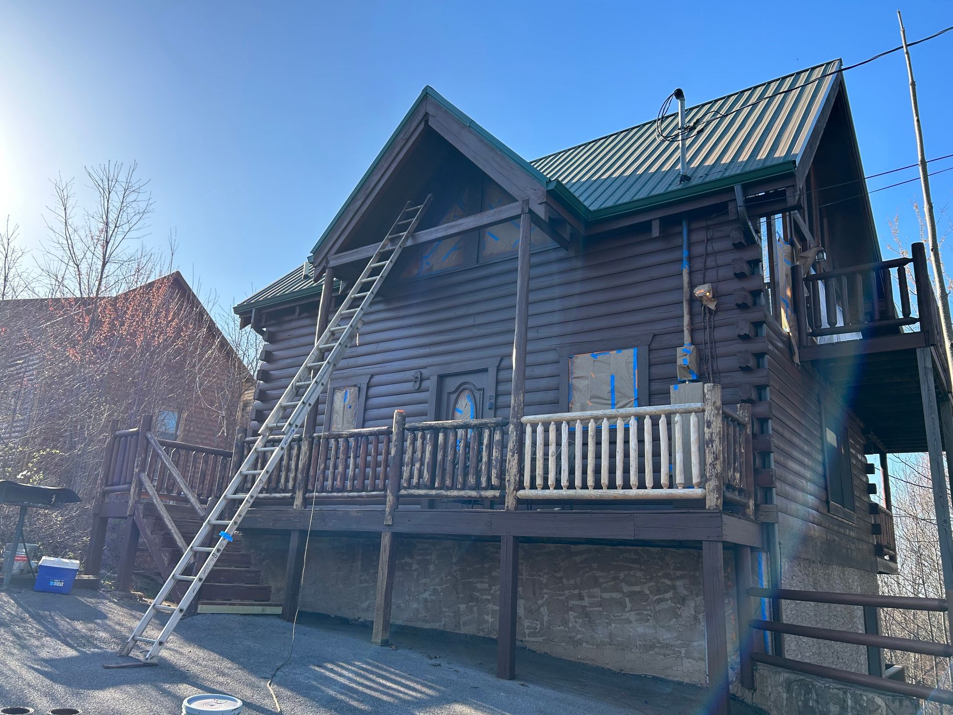 Before cabin staining by Whaleys Painting and  More in Pigeon Forge,TN