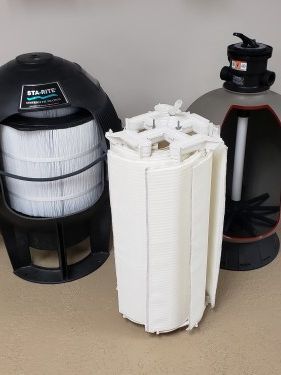 A group of swimming pool filters sitting on top of a table.