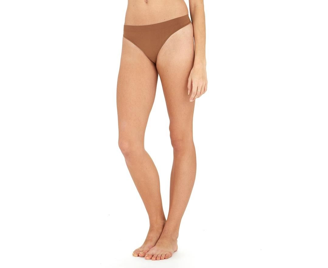 A woman is wearing a pair of brown bikini bottoms