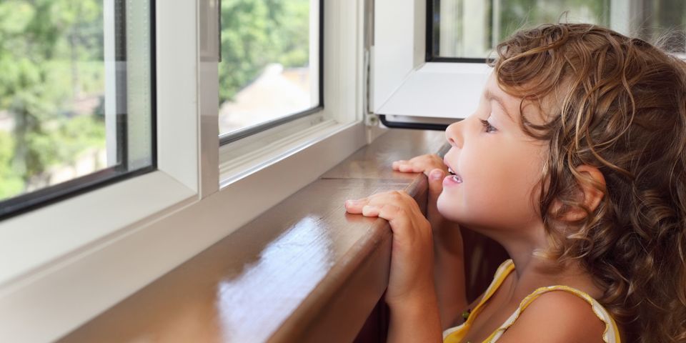 A Girl Looking Out The Window