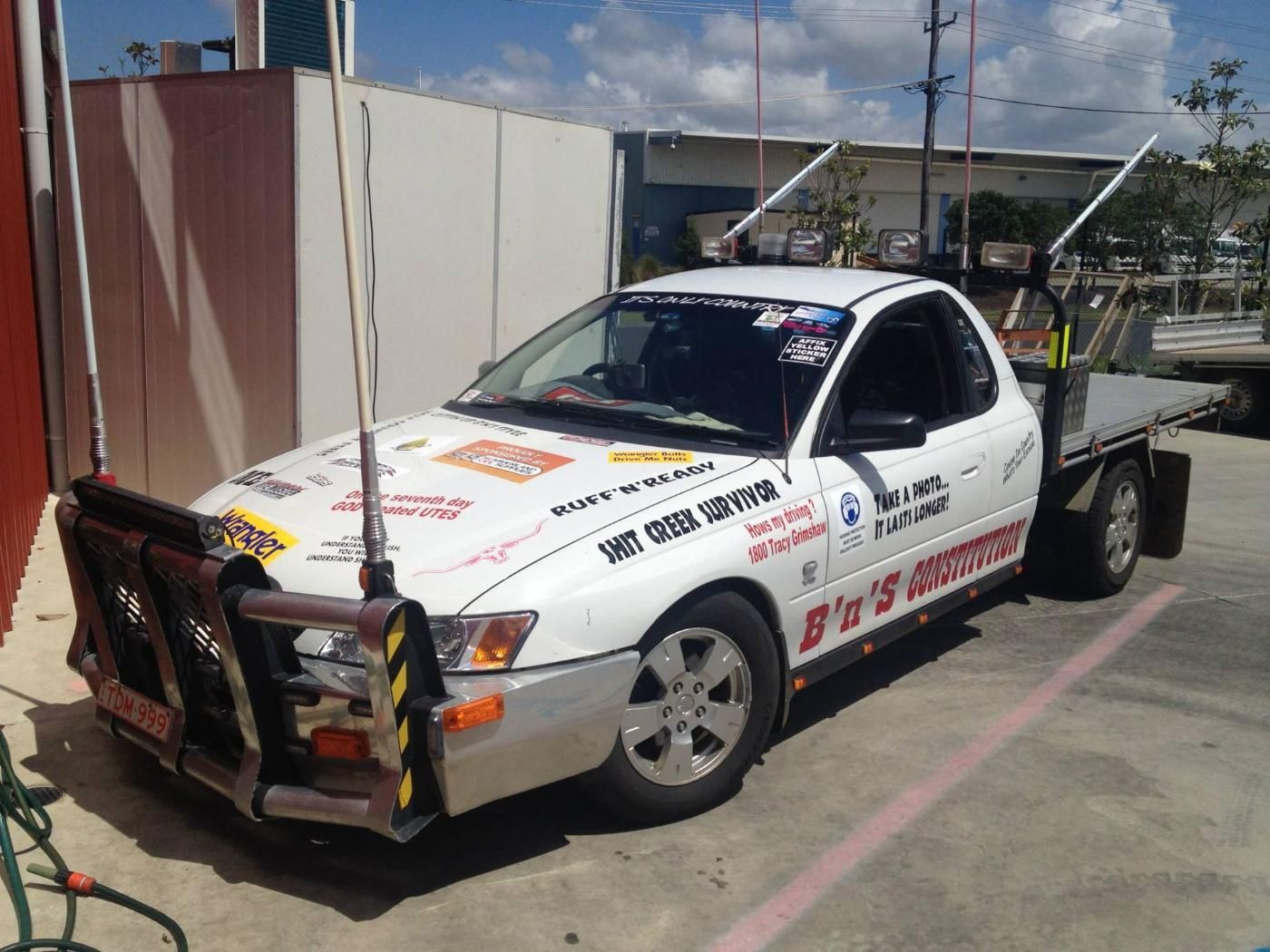 A White Truck With a Flat Bed is Parked in a Parking Lot — Summerland Tool Supplies In Casino, NSW