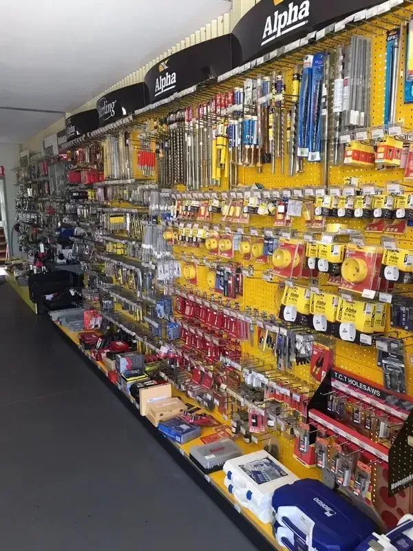 A store filled with lots of tools and a sign that says alpha