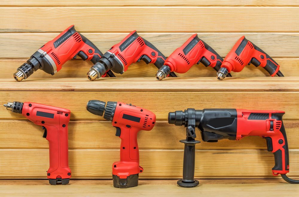 A Bunch Of Different Types Of Drills Are Sitting On A Wooden Shelf — Summerland Tool Supplies In Casino, NSW