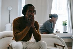 Black man thinking on a bench