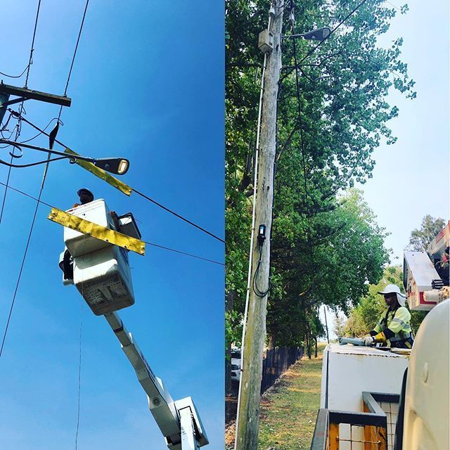 A man in a bucket is working on a power line
