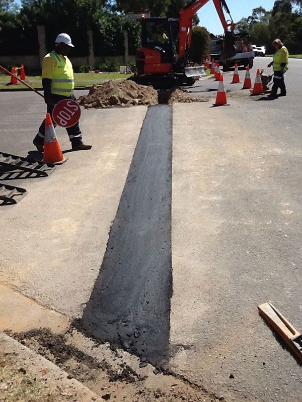 A man is holding a sign that says stop