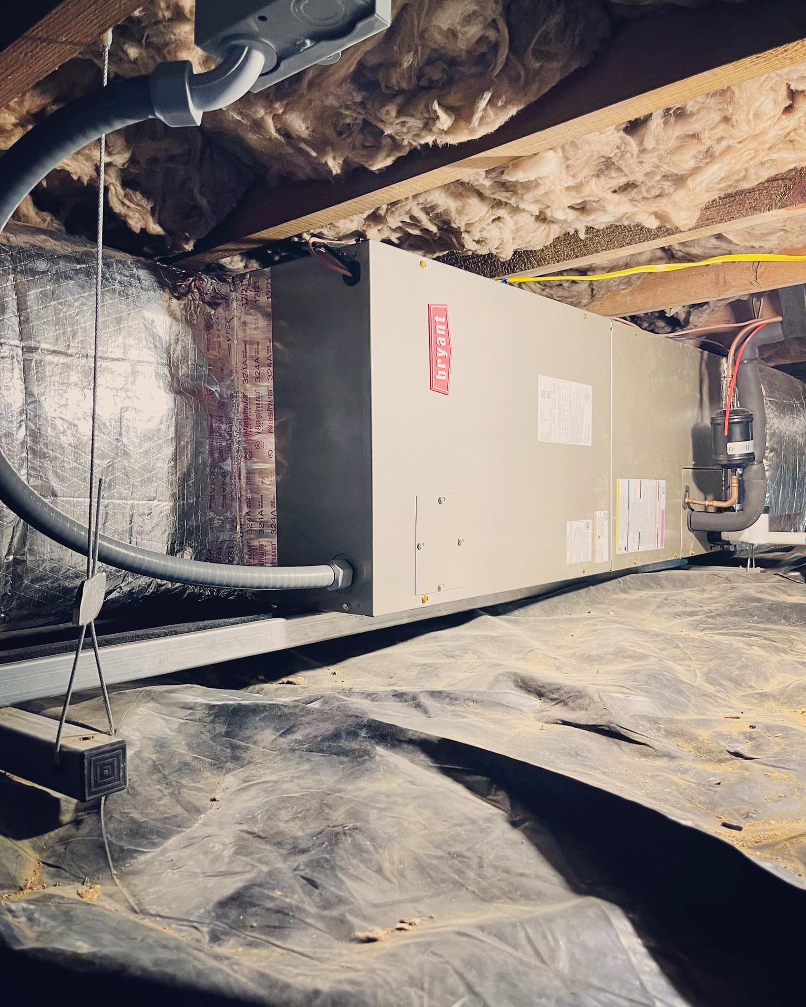 A picture of an air conditioner in a basement.