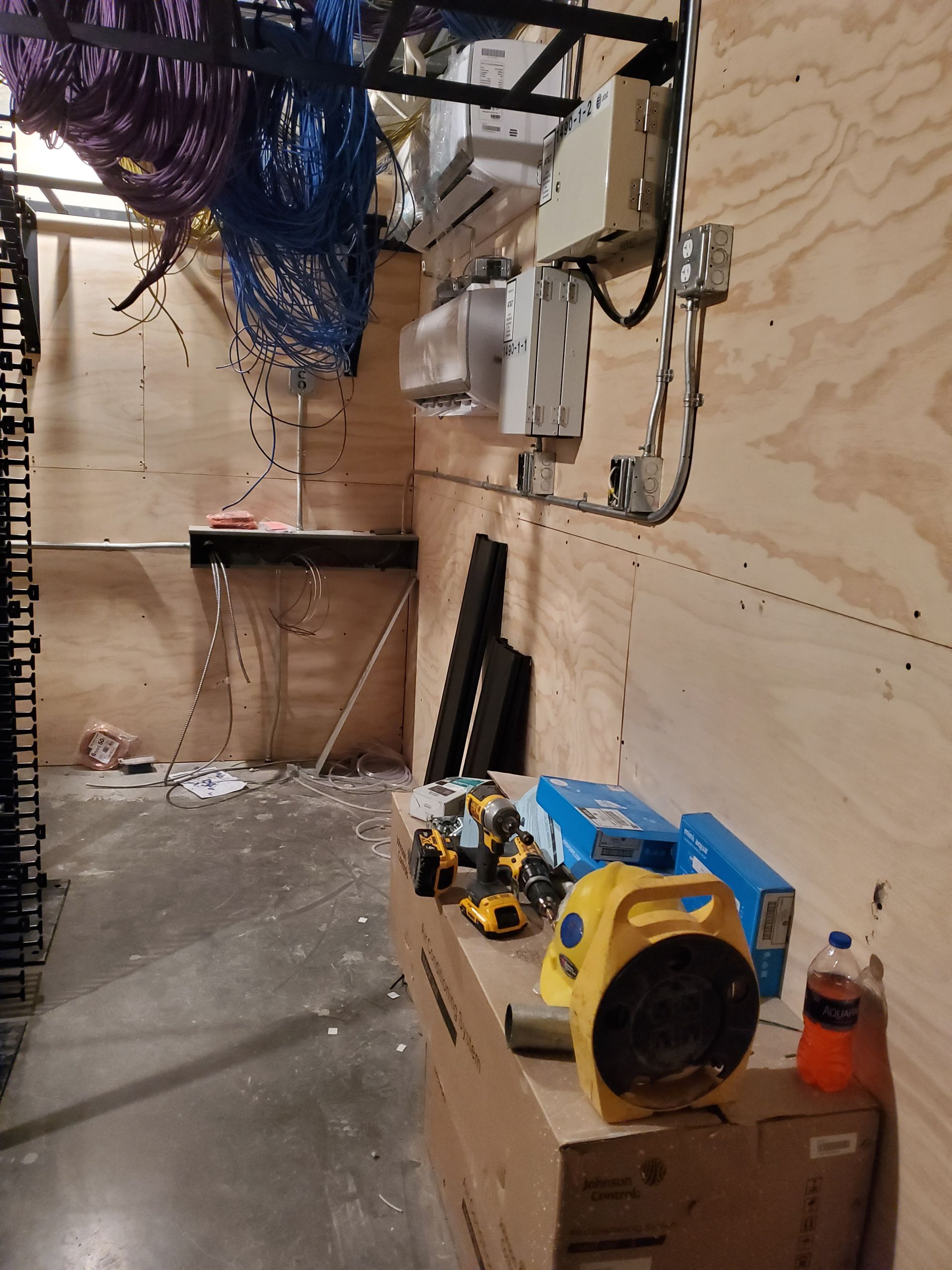 A room with a lot of tools and boxes on the floor