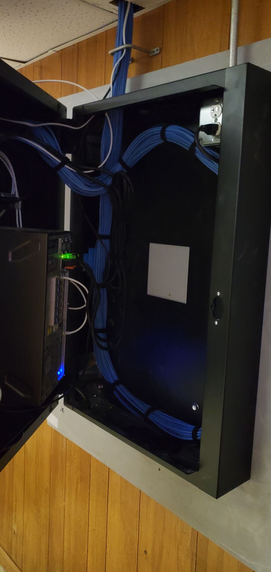 A black box with blue wires coming out of it.