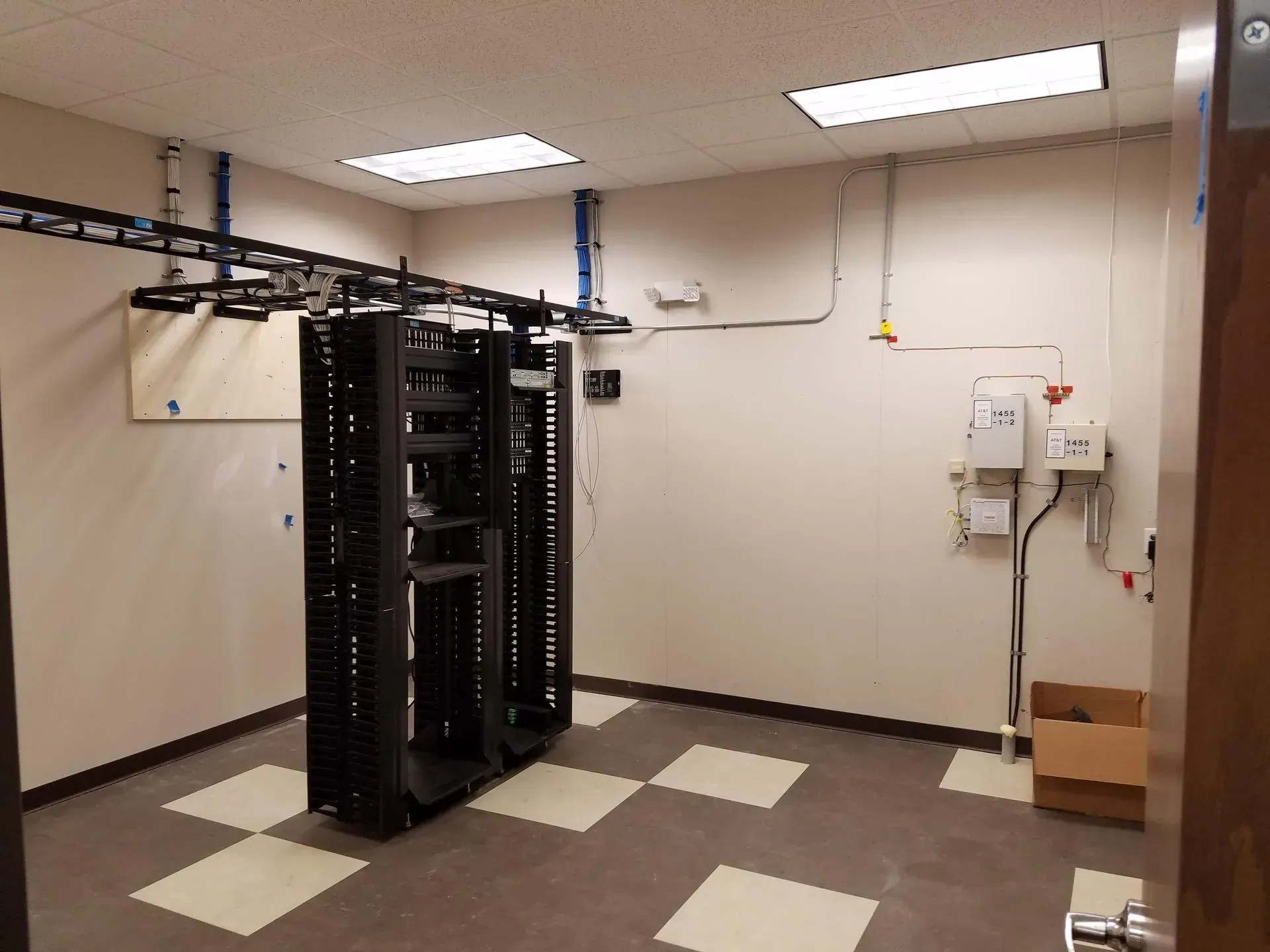 A room with a bunch of server racks in it