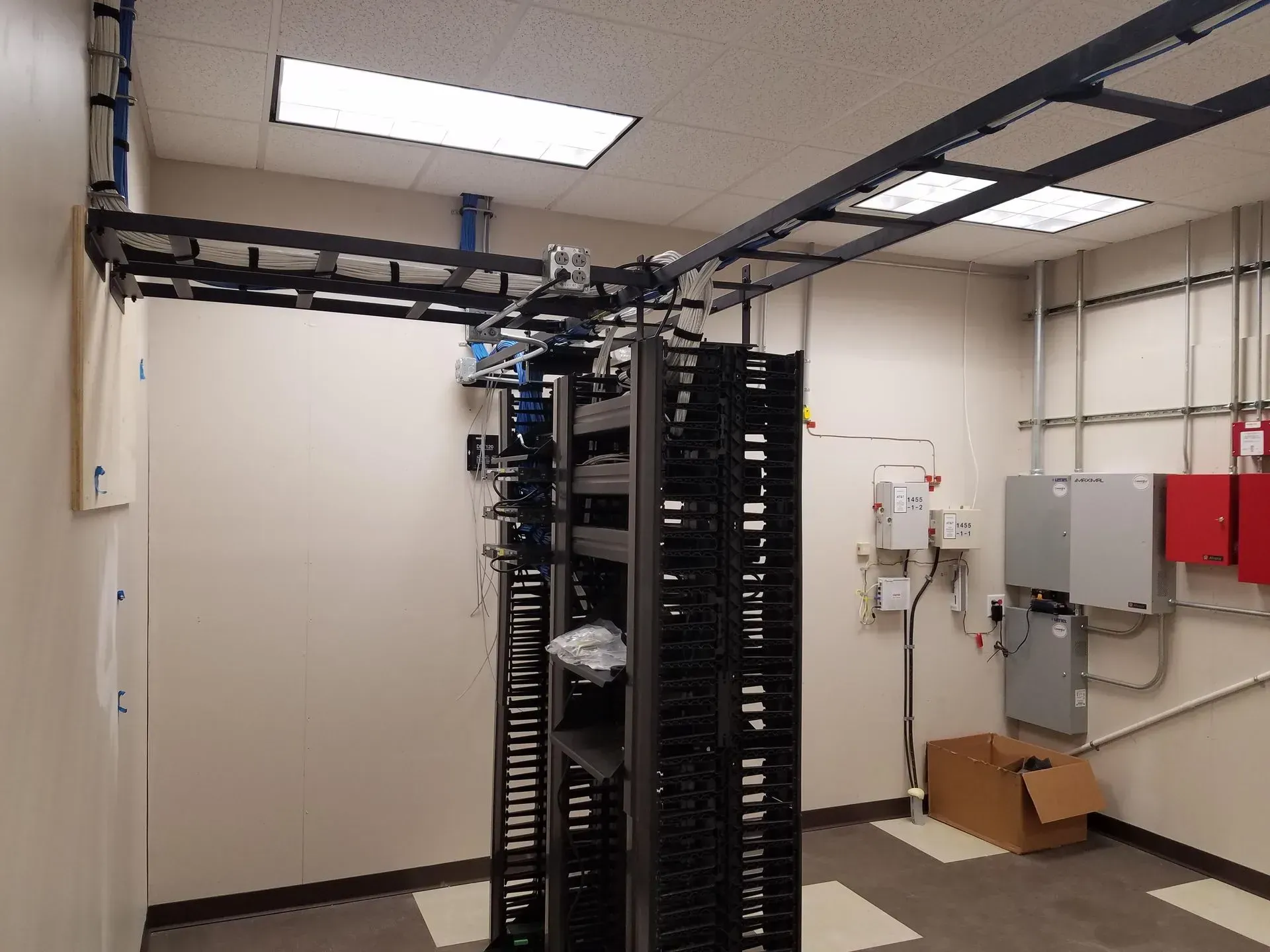 A room with a lot of server racks in it