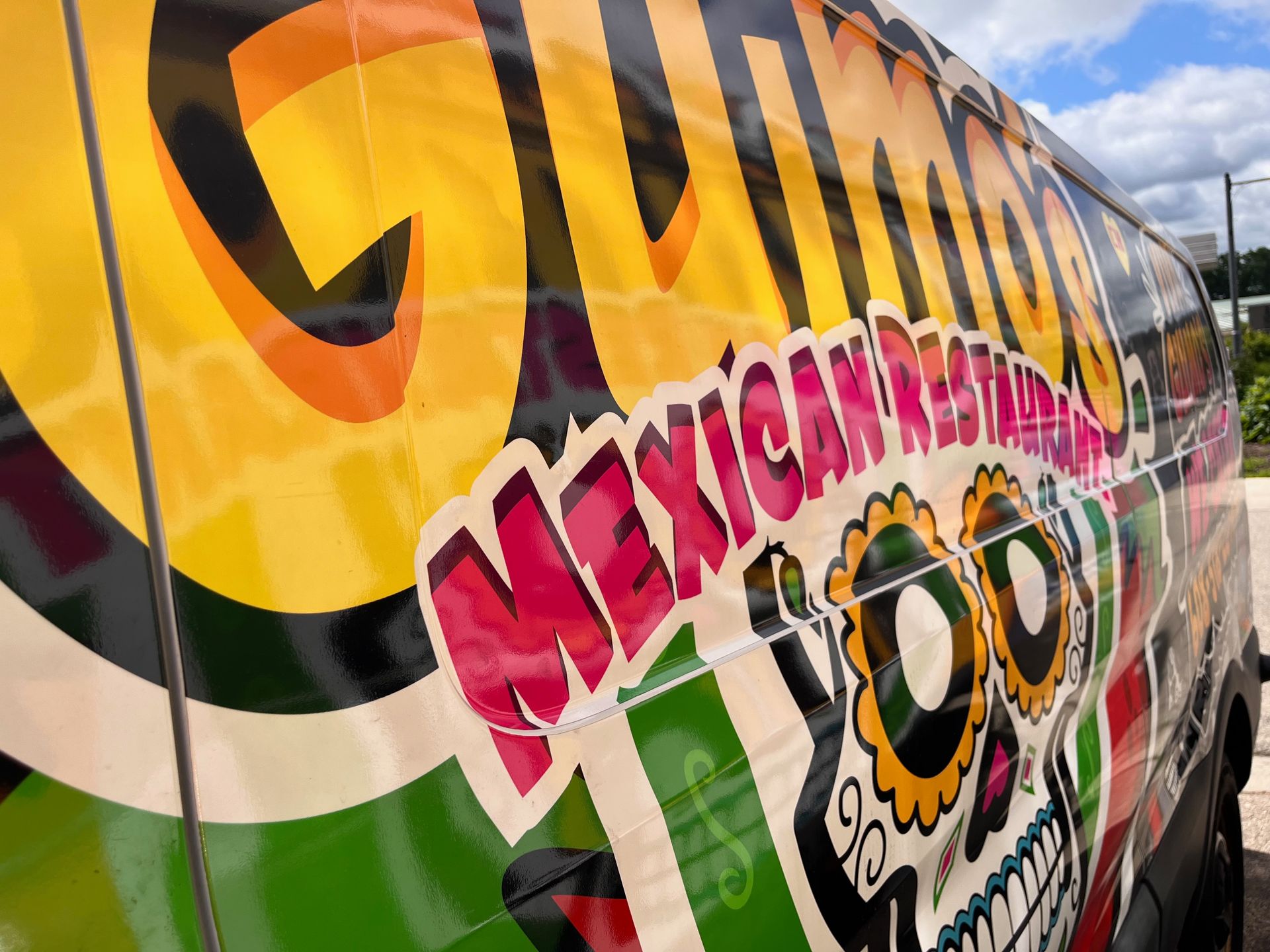 A colorful van with the word mexican on it