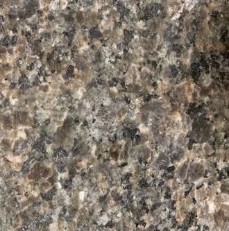 Close-up of speckled gray, brown, and black granite surface